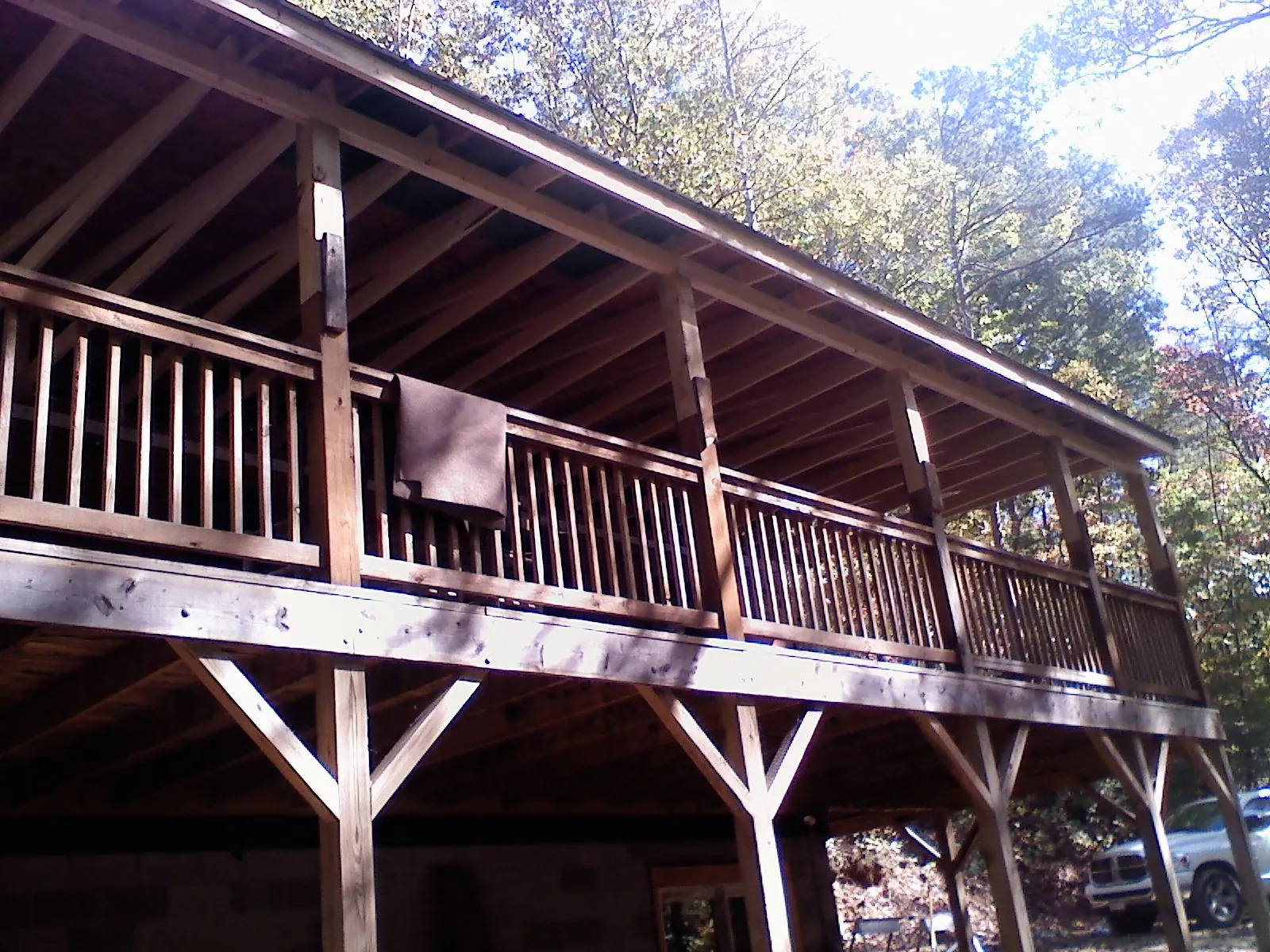 Timber framing under a new elevated porch and deck — Roof Leak Repair in Port Jefferson Station by Roofing Brothers